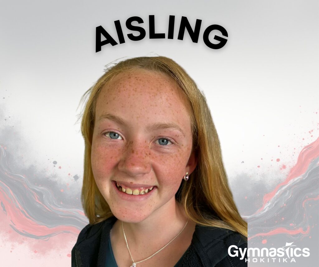 A smiling girl with long light brown hair and freckles poses in front of a pink and gray abstract background with the name "Aisling" above her and a "Gymnastics Hokitika" logo in the corner.